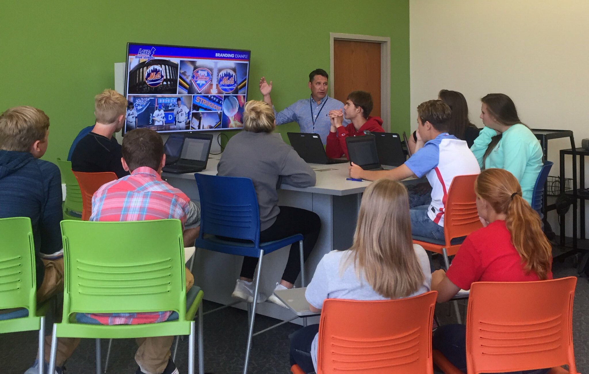 A group of people sitting at a table
Description automatically generated