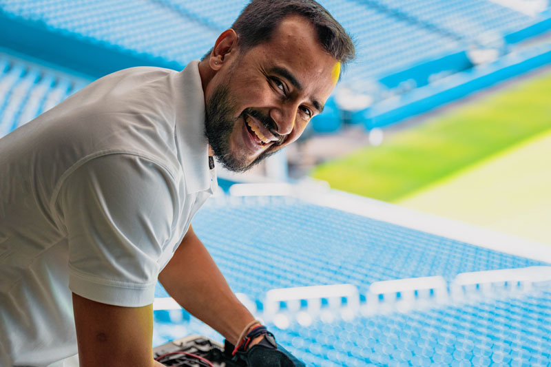 field service worker adjusting electrical wiring